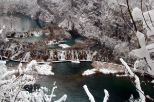 Lake surrounded by snow at Plitvice Lakes National Park